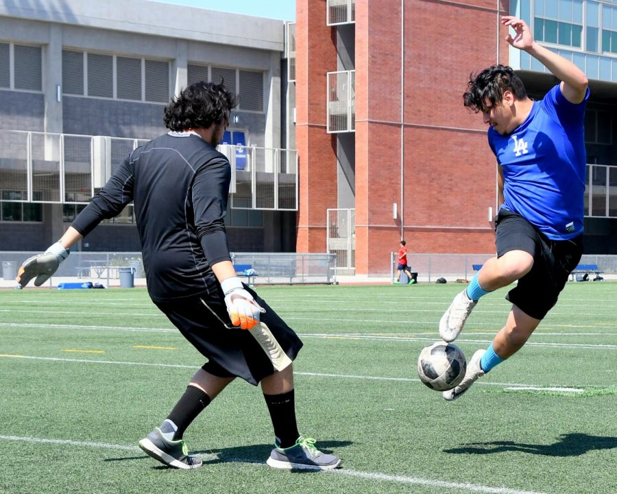 Gustavo Rosales (left) and Omar Solano (right) play soccer most Tuesdays at El Camino. Photo by Jack Kan