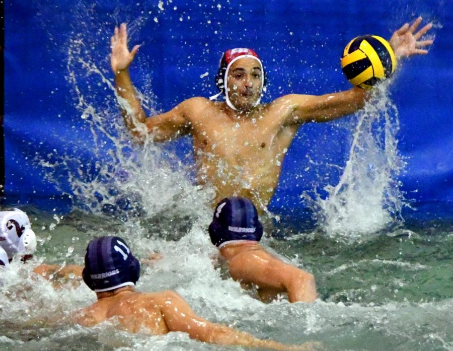 ECC goalie Brandon Soto rise out of the water to parry a shot during the ECC-Chaffey mens water polo game at the ECC swimming pool on Monday, Oct, 8. ECC lost the game by a score of 18-11. (Jack Kan/Union) Photo credit: Jack Kan