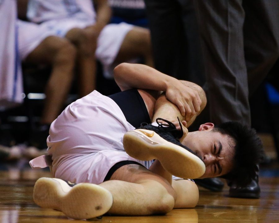 EC Warriors guard, Kyle Baba, suffers a right leg injury in the dying seconds of the game on a layup attempt, during the EC Warriors vs Pasadena City College mens basketball game at El Camino on Friday, Nov. 9. Photo credit: Darwyn Samayoa