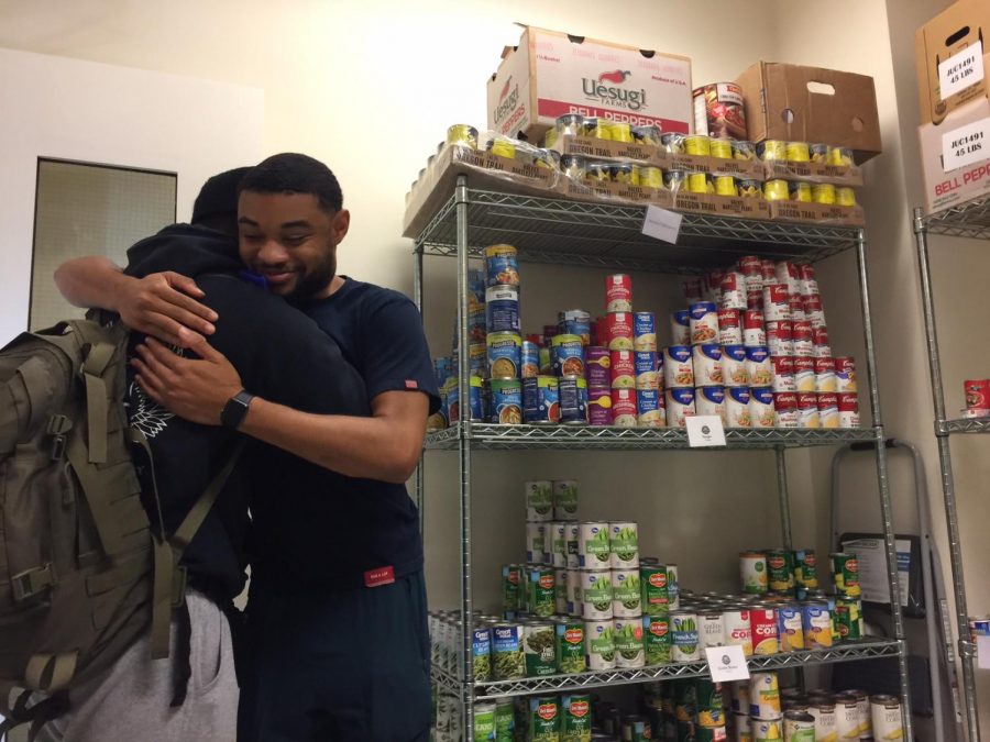 Sebastian Alejandro  Araque Vera,19, Chemistry major, and Isaiah Robinson, 20, Computer Science major and assistant at the Warrior Food Pantry,  thankful the day before Thanksgiving.