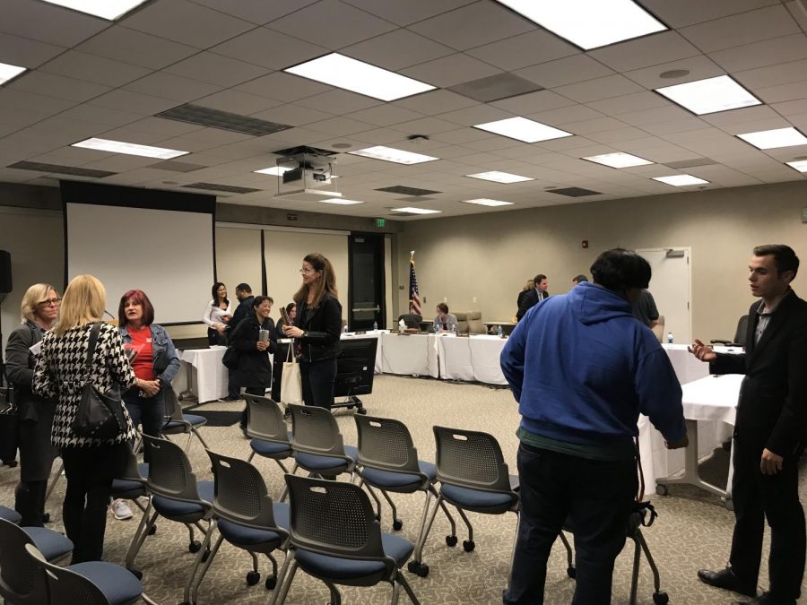 El Camino staff, faculty, and students, including ASO President Joey Mardesich (far right) mingling during the aftermath of the latest BOT meeting. Feb. 19, 2019. Photo credit: Fernando Haro