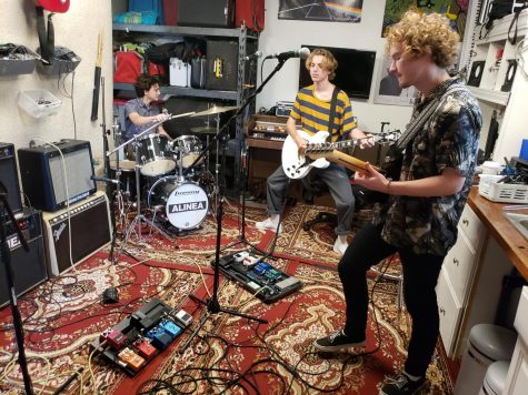 Lance Meliota, 18, drummer (left), John Barry, 18, guitarist and singer, and Ben Tyrrell, 20, guitarist and singer from the band Alinea rehearses for their performance at Beachlife Festival. Photo credit: David Rondthaler