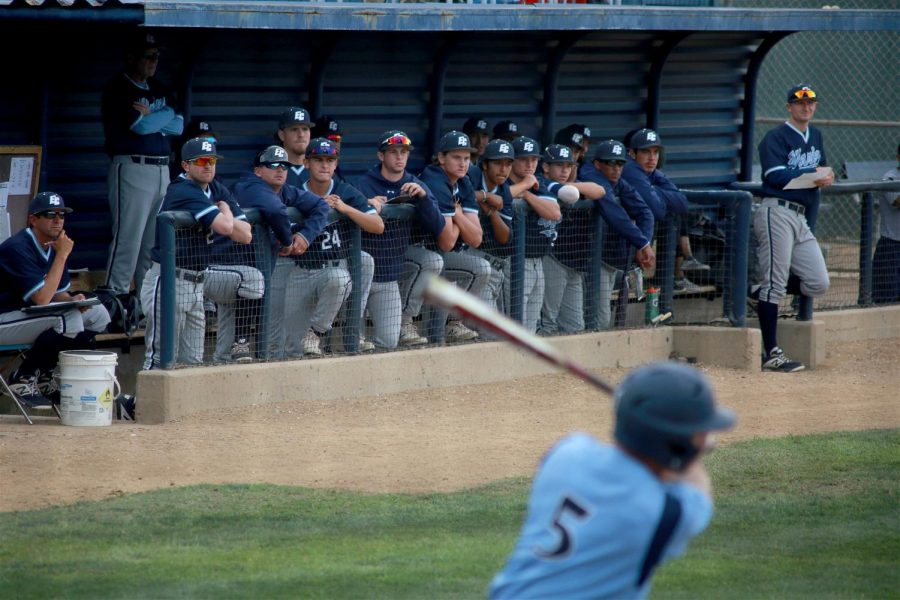 El Camino Warriors players watch Cypress Chargers catcher Eric Bigani up at the plate during Game 2 of their playoff series on Friday, May 10. The Chargers forced Game 3 for Saturday, May 11. Photo credit: Mari Inagaki