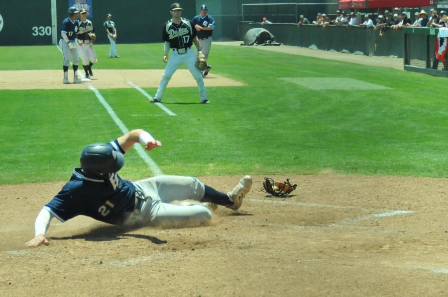 Warriors outfielder Ty Conrad slides home following a hit from teammate Joseph Borges against the Delta Mustangs on Saturday, May 25, at John Euless Ballpark in Fresno, CA. The Warriors won the game 5-3. Photo credit: Devyn Smith