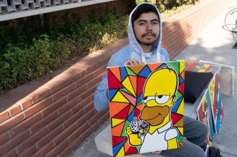 Daniel Galindo displays his artwork on a bench outside of El Camino College’s Schauerman Library on Thursday, Sept.19. Justin Traylor /The Union.