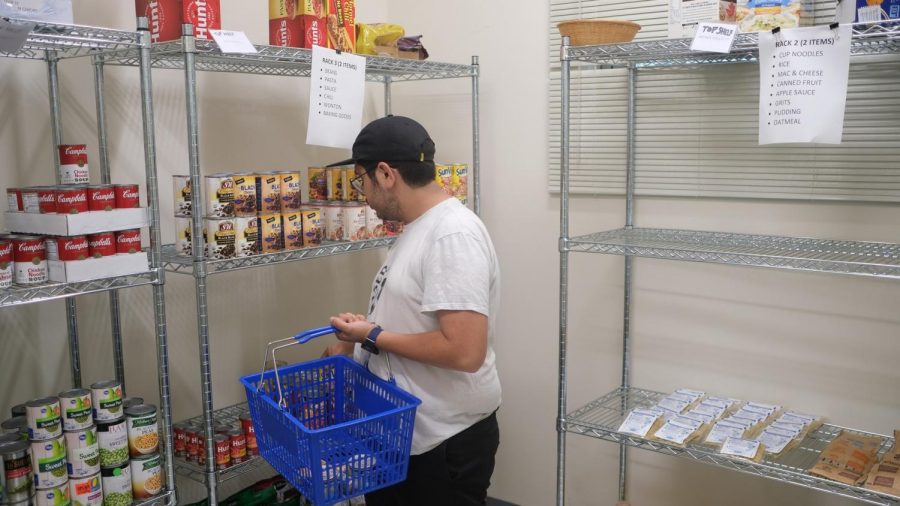 An El Camino College student peruses the racks at the Warrior Pantry on Friday, Oct. 18. The food pantry recently received a $10,000 grant from Los Angeles County Supervisor Janice Hahn, which will help purchase food items. David Odusanya/The Union