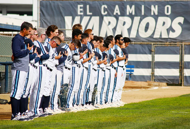 The El Camino College men’s baseball team stands solemnly during the national anthem before their game against Mt. San Antonio College, Friday, March 1, at Warrior Field. The Warriors won more games than of any California Community College in 2019. Mari Inagaki/The Union