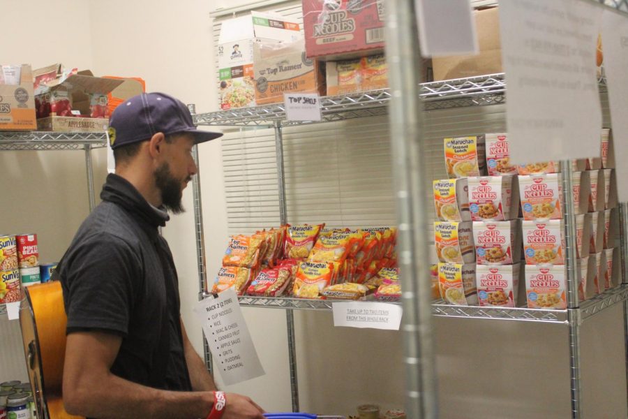 Michael Nicoli, 32, music major, browses the instant food section in El Camino Colleges Warrior Food Pantry on Monday, March 2. Eligible students can use newly available hot water to make foods including oatmeal and instant ramen. Kealoha Noguchi/The Union