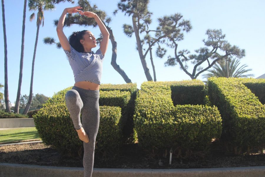 Jana Lipowski practices a piroette by the ECC bush in front of El Camino Colleges bookstore on Wednesday, Nov. 18. She started her journey here on campus three years ago, rekindling her passion for dance after six years after dance without it. (Jaime Solis/ The Union)