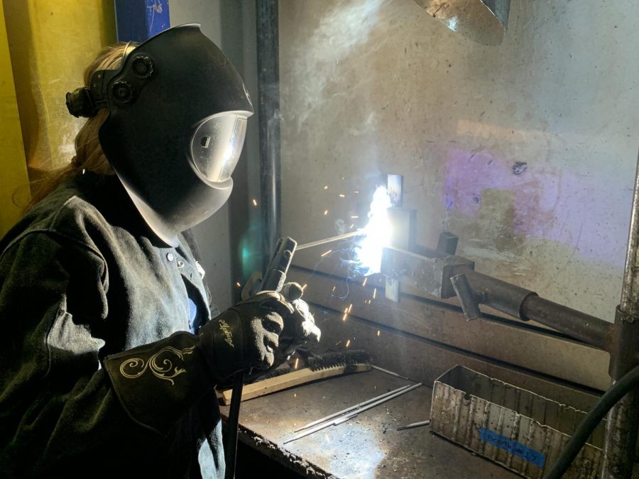 Gwendolyn Williams, 49 year-old welding major, welds together two pieces of metal in her Welding 1B class at El Camino College on March 10, 2021. Some essential lab classes, like welding, are happening at ECC despite most courses being conducted online. (Molly Cochran/The Union)