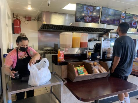 A customer waits to order at Pupusatown, located across the street from El Camino College. (Photo by Molly Cochran/ Warrior Life)