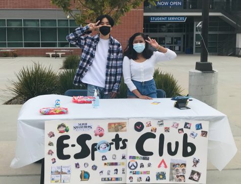 Wolfgang Ozamaki and Shaira Villanueva stand in front of their club booth before Club Rush begins. This is the first Club Rush the newly recreated Esports Club is attending at El Camino College. (Nicholas Broadhead/ The Union)