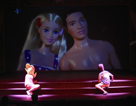 During the comedy play “Psycho Beach Party” written by Charles Busch, characters, Chicklet, left, listens to Star-Cat, right, explain what he and his girlfriend Marvel Ann do when they’re alone, while the onstage screen illustrates with two Barbie dolls the risqué scene that garnered laughter from the audience. Photo by Mari Inagaki/The Union