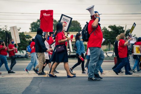 Members and supporters of the El Camino College Teachers' Federation march past the ECC campus on October 7.  It was during their last educational campaign before reaching an agreement with the district.  The Federation had negotiated with the district for weeks to adjust the cost of living.  Photo by: Shawn Rodriguez / The Union.