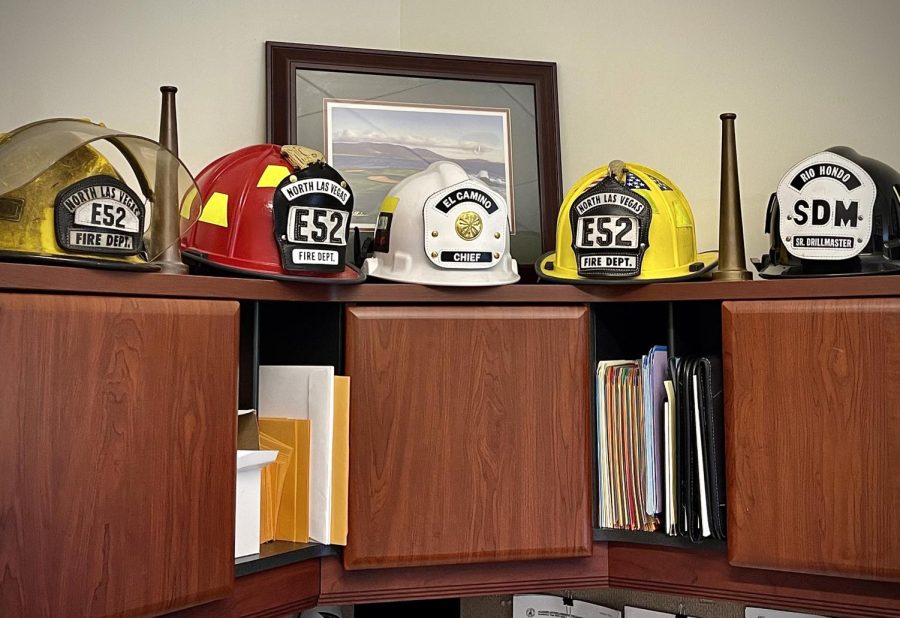 Helmets from several fire departments decorate Chief Jeffrey Baumunk's office at El Camino College on Nov. 1. Before starting as an instructor at ECC’s Fire Academy, Baumunk retired from a career with North Las Vegas Fire Department, worked at JPL and La Verne Fire Departments, and taught at Rio Hondo Community College Fire Academy. In over 30 years in fire service, Baumunk has never served with a woman chief.