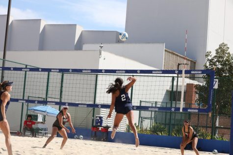 Freshman Kaila Siu leaps for an attack on the 4's sand court during a match against Santa Ana's Leslie Leon and Andrea Sanchez. Paired with Emily Uhrinak, Siu helped defeat Sanchez and Leon (21-14, 21-18). Photo by Greg Fontanilla/The Union