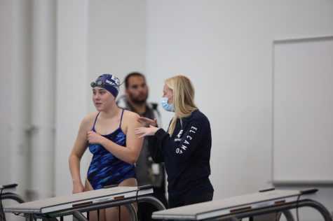 Freshman Lauren Hernandez and her coach, Shelby Haroldson before the start of the women's 500 yard freestyle. Hernandez completed the event with a time of 6:45.22, placing 7th. Photo by Greg Fontanilla/The Union