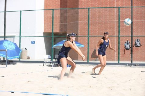 El Camino's Emily Uhrinak sets up for a pass with Athina Sarreas during a home game against Grossmont's Francesca Stroup and Karsen Carroll. Uhrinak/Sarreas defeated Carroll/Stroup 2-1 (14-21, 21-10, 15-6). Photo by Greg Fontanilla/The Union
