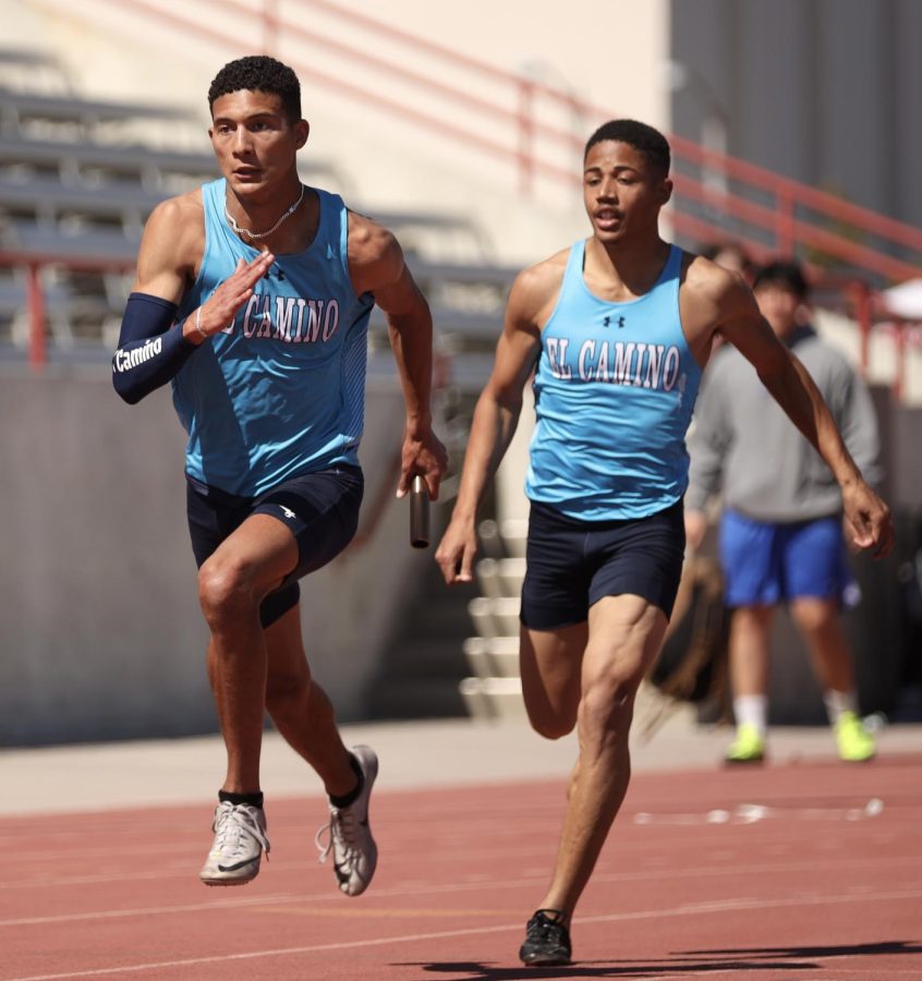 Xerxes Reamer completes a baton pass to Jaylen Allen in the mens 4x100 relay, at the LBCC Viking Invitational in Long Beach on Friday, March 11. El Camino A squad, consisting of Reamer, Allen, Matthew Irvine, and Kyvontei Campbell, ran a time of 42.58, placing 2nd overall. The Warriors will be at the RCC Open on March 18 at Riverside City College. (Greg Fontanilla | The Union)