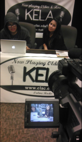 Delfino Camacho (Left) and an unidentified classmate work on a news script before recording for the KELA student newscast during a broadcasting class at East Los Angeles College, May 2013. Camacho would leave school later that summer due to his parents' health issues. Image provided by Delfino Camacho