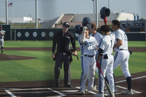 Catcher Jorge Alonso Renteria (#31) celebrates his two-run blast with his teammates at home plate. Renteria's homerun paced El Camino to the victory against the Rio Hondo Roadrunners. The game took place at Warrior Field in Torrance, CA on March 10, 2022. Photo by Vitor Fernandez.