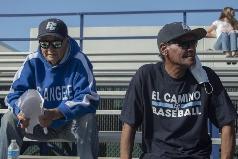 El Camino Warriors superfans and former students George Guerrero (left) and Bill Brocato (right) watching closely. The superfans follow the Warriors baseball team no matter where they are playing. Photo by Vitor Fernandez.