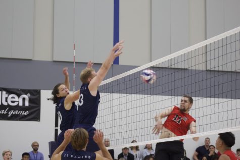 Warriors' outside hitter Andrew White (left) and middle blocker Spencer Isley (middle) jump up to block a spike from Vikings' middle blocker Alfred Dougherty (right) at the CCCAA State Semifinals match on Thursday, April 21. (Ethan Cohen | The Union)