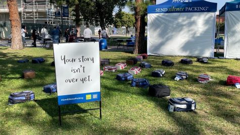 The Send Silence Packing exhibition displays numerous backpacks across Library Lawn with photos and stories of individuals who have taken their lives and have survived suicide attempts. (Ethan Cohen | The Union)