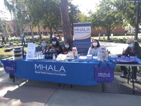 Mental Health America of Los Angeles had a booth and resources available at the Send Silence Packing event on the Library Lawn at El Camino College on Monday, April 4. (Charlie Chen | The Union)