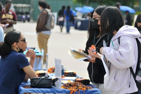 El Camino College students at the University Fair meeting with various CSU, UC and Private university representatives learning about admission requirements, the transfer process, and what life's like on campus at the Student Services Plaza in El Camino College in Torrance, Calif. on April 26, 2022. (Charlie Chen | The Union)