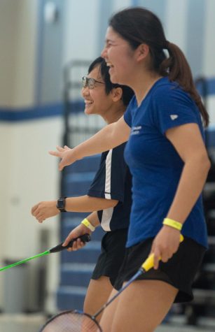 El Camino College Badminton players Montila Winyaworapon (left) and Marina Mongaki (right) share a laugh during a game against the Irvine Valley College Lasers in the El Camino Gymnasium at El Camino College in Torrance, CA, on Friday, April 1, 2022. Winyaworapon and Mongaki are still able to have fun, even with a loss score of 18-3. (Naoki Gima | Union Photo).