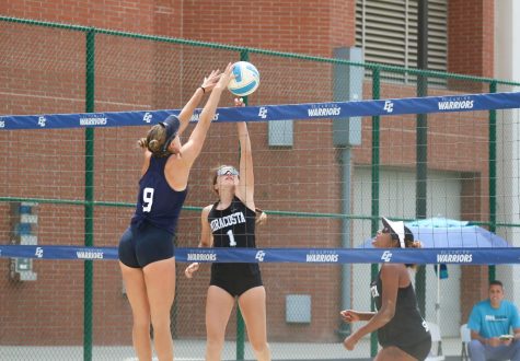 El Camino College Warriors No. 4 pair Emily Uhrinak (#9) jumps to block opponent MiraCosta College Spartan Summer Hoslett (#1). Uhrinak would ultimately get the point and win the set for the Warriors playing to their 4-1 match win. (Ethan Cohen | The Union)