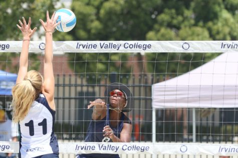 El Camino College Warrior No. 2 pair Ginia Goods (#8) spikes the ball against Irvine Valley opponent Kendall Nolan (#11) at the Irvine Valley Sand Courts on Thursday, May 12. Goods (#8) and partner Kaila Siu (#2) lost their match to the Laser 21-9, 21-10. (Ethan Cohen | The Union)