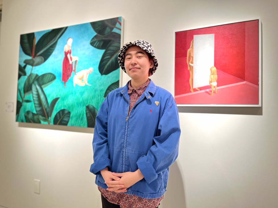 Marcus Rodriguez stands in front of the artworks Phyllis and Aristotle and Mother and Daughter by Palmer Earl. Marcus curated the art gallery Closer Now in Torrance Art Museum that ran from April 2 to May 14. (Maureen Linzaga | Warrior Life)