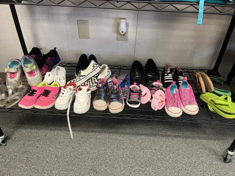 Shoes are on display in the children's section of the Warrior Closet, May 10. These shoes vary by style and age, including pink baby shoes and kids dress shoes. Elizabeth Basile | The Union