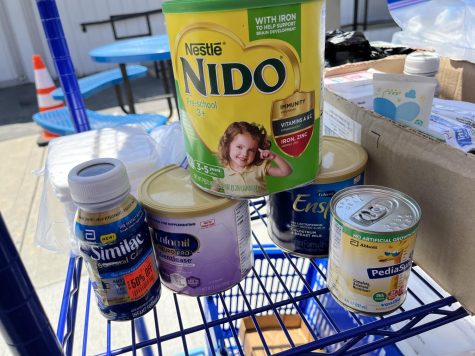 Cans of baby formula are on the shelf at the Warrior Pantry drive through station, May 26. Other baby products distributed include diapers. Elizabeth Basile | The Union