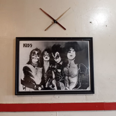 A framed photograph of the band KISS rests atop the KISS themed dining table at Alexanders World Famous Tortas restaurant, the drumsticks above the frame are reportedly not from an old KISS show. Photo taken November 4, 2021. Delfino Camacho | The Union.