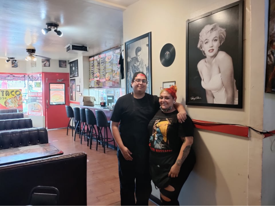 Married couple and co-owners Omar “Alexander” Flores and Angelina Rodriguez pose in front of their Latino and rock n’ roll themed torta joint, Alexanders World Famous Tortas on Friday November 5, 2021. (Delfino Camacho | The Union)