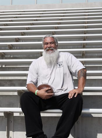El Camino football coach Kenneth Talanoa sits in the stands at Featherstone Field at the El Camino College campus in Torrance on Monday, May 16. Talanoa will be entering his 21st season as the defensive line coach. He has been a part of Warrior football not only as a coach, but also played for the late John Featherstone in the early 90s. Additionally, he was inducted into the El Camino football Hall of Fame and named to the 1990s All-Decade team. (Greg Fontanilla | Warrior Life)