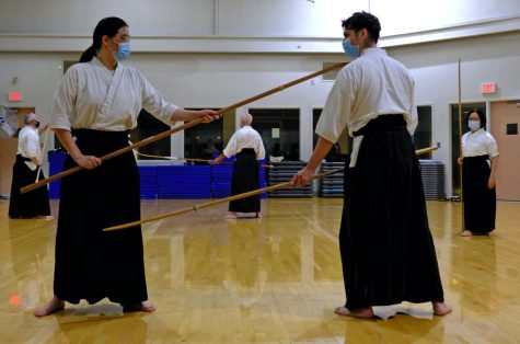 Newlyweds Grace Wu (L) and Ruben Ramirez discovered Naginata while attending El Camino College 11 years ago. Grace received her third degree black belt after being tested in Virginia in 2020. Ruben received his fourth degree black belt after being tested in Germany in 2020. (Jose Tobar | Warrior Life)