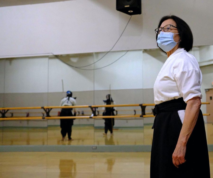 Naginata instructor Helen Nakano observes her students during an evening practice at the Japanese Cultural Center in Torrance on Thursday, Oct. 21, 2021. She taught naginata at El Camino College until the pandemic forced her off-campus. Helen was the first-ever teacher to start a naginata class in America. (Jose Tobar | Warrior Life)