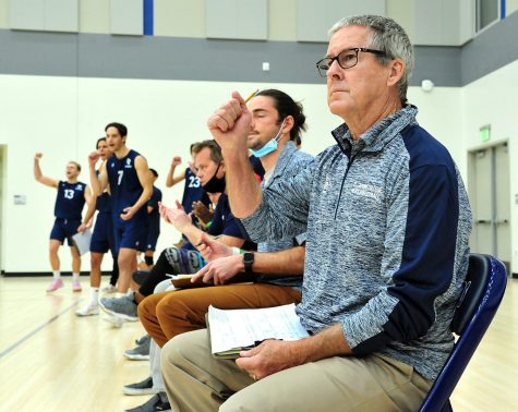 El Camino College men&squot;s volleyball Head Coach Richard "Dick" Blount signals his approval during the March 11, 2022, match against the Long Beach College Vikings at ECC. The Warriors upset the No. 2-ranked Vikings to improve their conference record to 4-1 and 7-4 overall. Dick has been the head coach since 2001. (Gary Kohatsu | Warrior Life)
