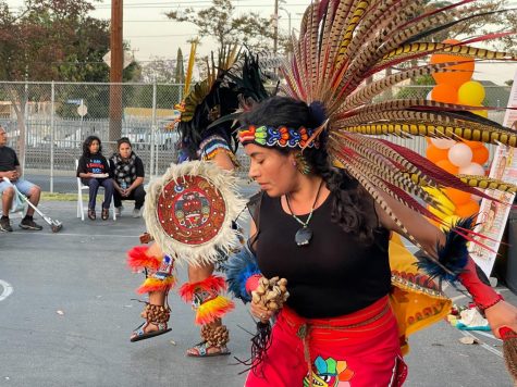 Danzantes Mexicas gives a blessing to the six directions and performs several ceremonial dances to honor people killed by law enforcement or community violence at a candlelight vigil on April 30 at Fred Roberts Park in South Central Los Angeles. (Kim McGill | The Union)