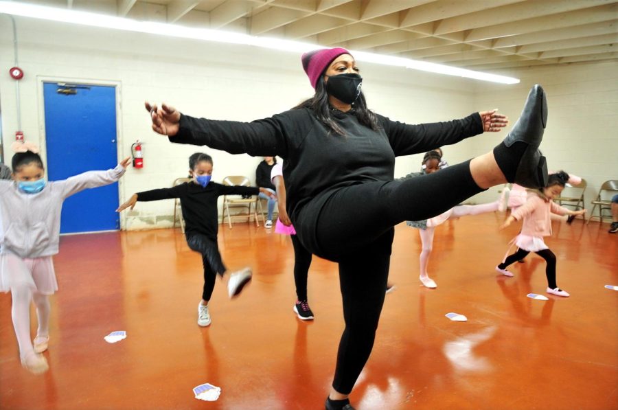 Youngsters mimic teacher Tamara Kemp as they learn various ballet techniques on their first day of tap-ballet class at Freeman Park in Gardena. Tamara learned tap and ballet as a 4-year-old child growing up in Inglewood. Among her credits, Tamara was a dancer for the TV dance show “Soul Train.” (Gary Kohatsu | Warrior Life)