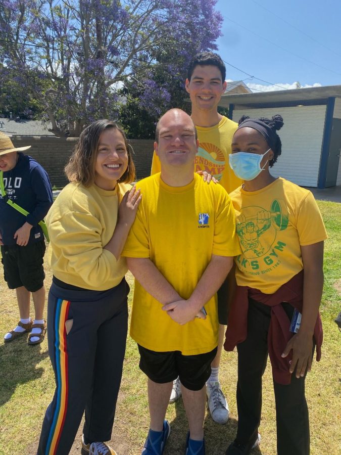Araceli Espinoza (left), Sebastian Lipstein (top center), Tyler Carron (bottom center) and Simone Thompson (right) take a break during walking club for The Friendship Foundation at Dale Page Park in Redondo Beach on Monday, May 16. This is just one of the many activities that the foundation does six days a week. Photo courtesy of Maddy Silver