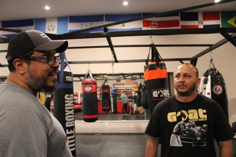 Ramon Espada (left), originally of Chicago and now a coach that trains fighters at several locations including New Era Boxing Club in Reseda, Calif. explains the meaning of “sweet science” in the world of boxing at Sweet Science Boxing & MMA Gym in Hawthorne, Calif. on Thursday, April 7, 2022 while the gym’s founder, Marco Trejo, listens attentively. “Boxing is a ‘sweet science,’ that’s what it is,” says Espada. According to Espada, the term dates back to early 1900s. “Boxing is very scientific, there’s a lot of angles and anticipation of what’s happening, so there’s a lot of calculation. And, calculations are happening in milliseconds. What happens when you get something wrong? You get punched in the face. It’s a high level of science that you better get right.” Espada says that people often think of intelligence as something that’s gained from books. “Boxing is a very intelligent man’s sport, contrary to popular belief,” Espada says. “The intelligence it takes to succeed in the ring is a very high level.” (Kim McGill | Warrior Life)
