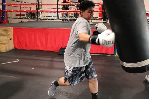 Joey Leon, 13, of Compton, Calif. works the heavy bag at Sweet Science Boxing & MMA Gym in Hawthorne, Calif. on Thursday, April 7, 2022. He hopes to become "a world champion.” Sweet Science provides young people a safe place after school with access to boxing classes, one-on-one coaching and opportunities to compete, all intended to develop their athletic and leadership skills. (Kim McGill | Warrior Life)