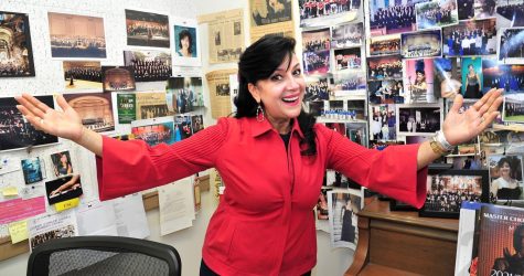 With her office walls adorned with photos and news clippings, Joanna Nachef shares the history of her musical accomplishments. She is a native of Beirut, Lebanon. (Gary Kohatsu | Warrior Life)