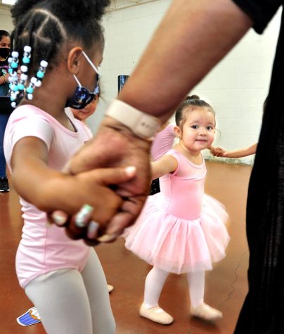 Penelope Morales, 2, at right, is one of the youngest dance students as she takes part in a circle exercise. Teacher Tamara Kemp says that some of her exercises are designed to help kids overcome their shyness. (Gary Kohatsu | Warrior Life)