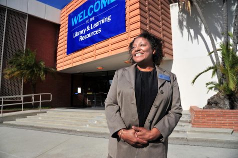 El Camino College President Brenda Thames stands in front of the college's Schauerman Library on April 21. The majority of Brenda's favorite places to visit on campus are linked to El Camino faculty and staff members that she enjoys working with and greeting, like the librarians. (Gary Kohatsu | Warrior Life)